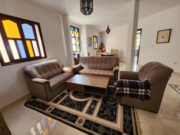 Happy family enjoying a Kridari rental apartment’s living room.