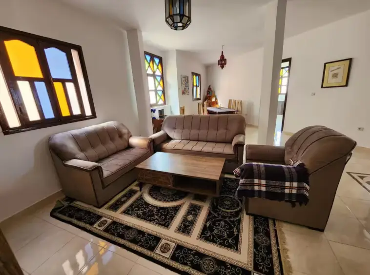 Happy family enjoying a Kridari rental apartment’s living room.