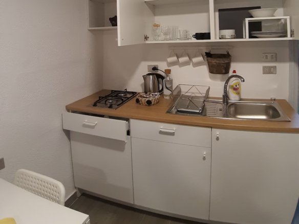 Warm Kridari rental kitchen area.