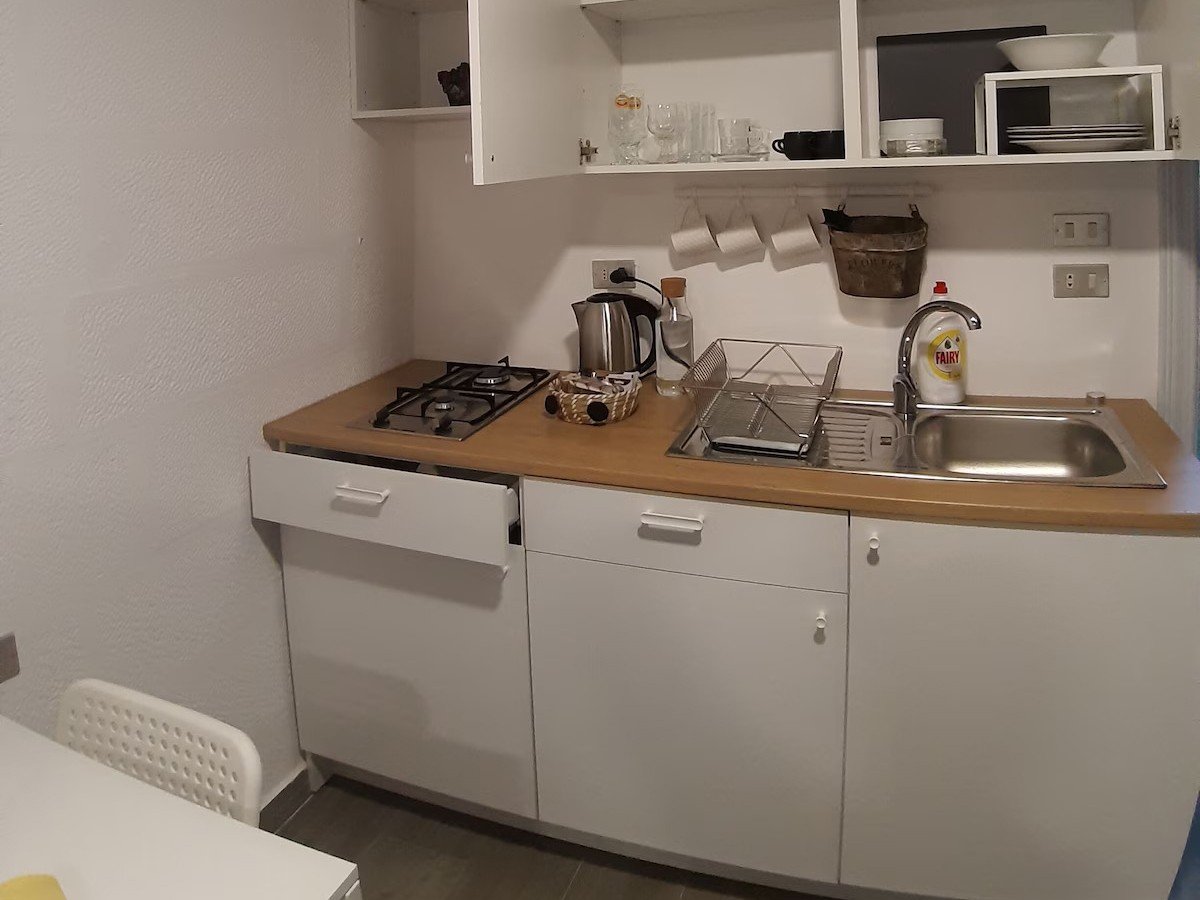 Warm Kridari rental kitchen area.
