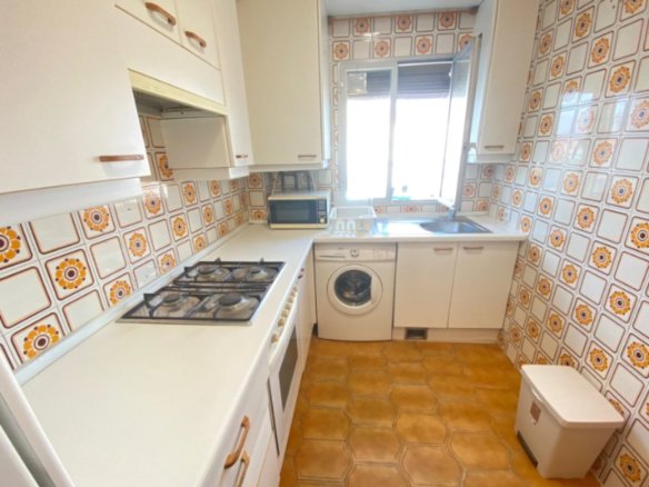 Cozy Kridari rental kitchen area.