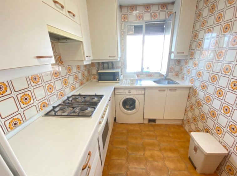 Cozy Kridari rental kitchen area.