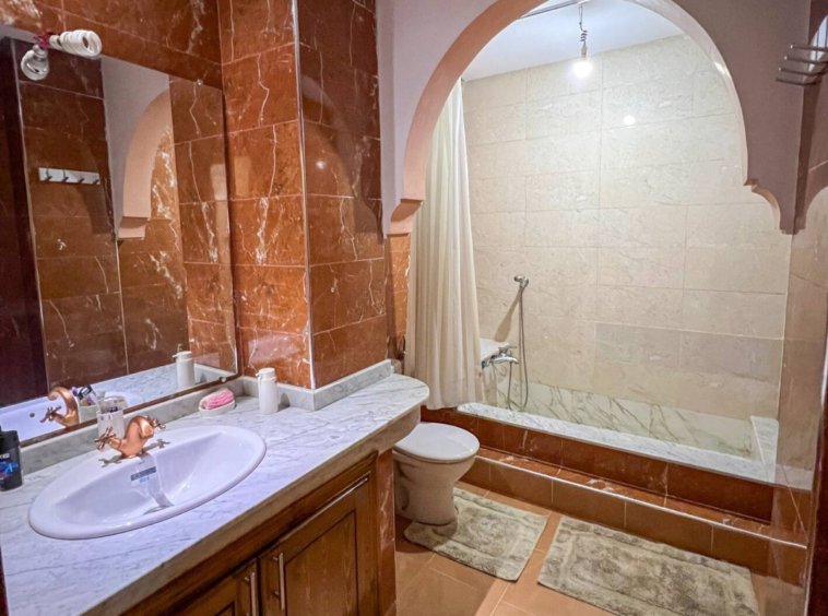 Modern bathroom with a bidet in a Kridari-managed apartment.