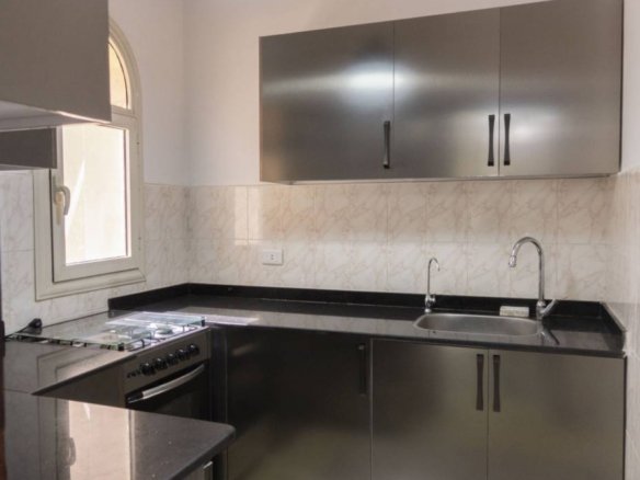 Elegant kitchen with custom cabinetry in a Kridari rental.