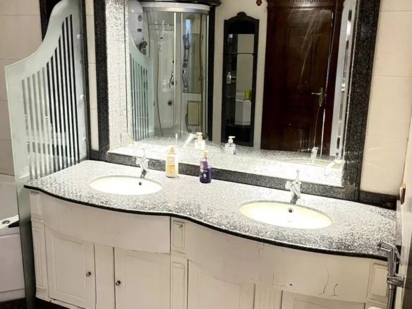 Modern bathroom with a bidet in a Kridari-managed apartment.