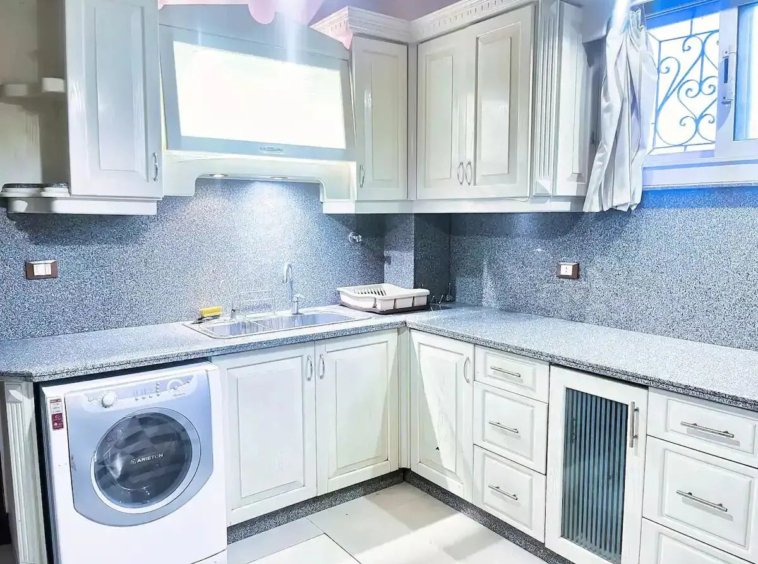 Elegant kitchen with custom cabinetry in a Kridari rental.