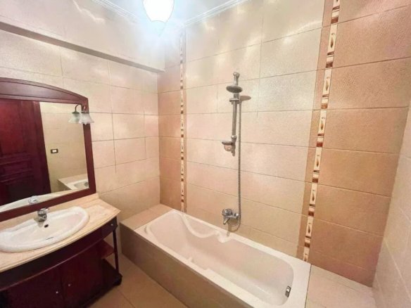 Contemporary bathroom with a glass shower in a Kridari home.