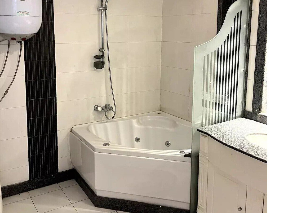 Sleek bathroom with double vanity in a Kridari property for rent.