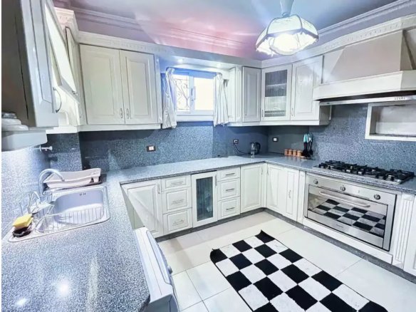 Fully equipped kitchen in a Kridari apartment for comfortable living.