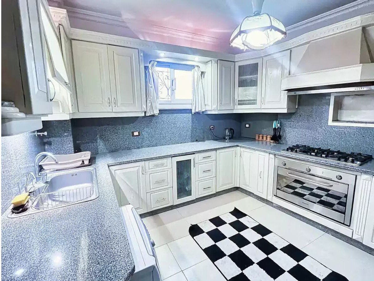Fully equipped kitchen in a Kridari apartment for comfortable living.
