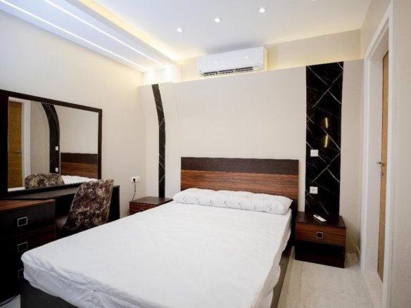 Relaxing bedroom with plush bedding in a Kridari rental home.