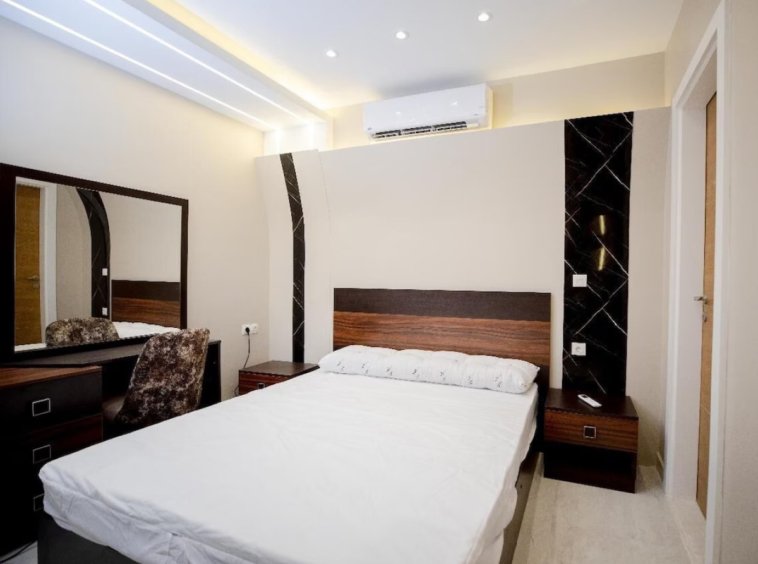 Relaxing bedroom with plush bedding in a Kridari rental home.